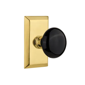 Studio Short Plate with Black Porcelain Knob in Polished Brass